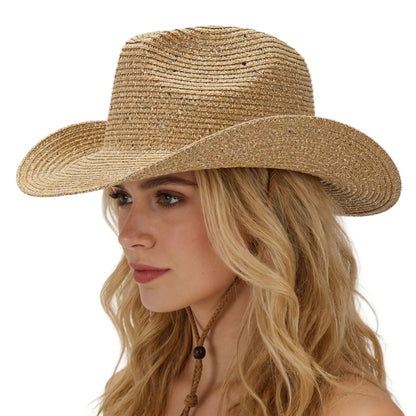 Woman wearing a straw hat against a plain background