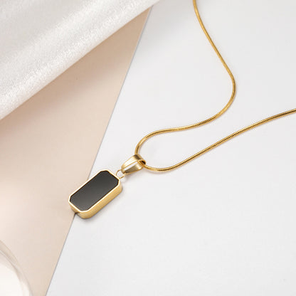 Noir gold necklace pendant detail
