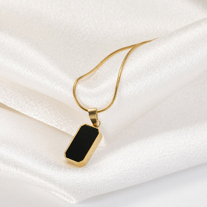 Noir gold necklace chain detail close-up