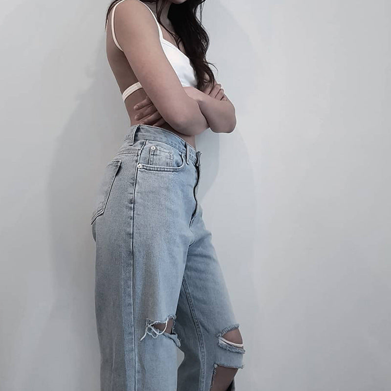 Ripped high rise jeans back view