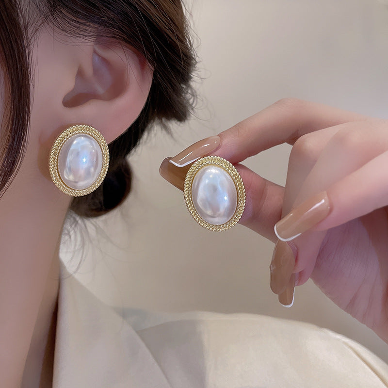 Radiance pearl stud earrings on model