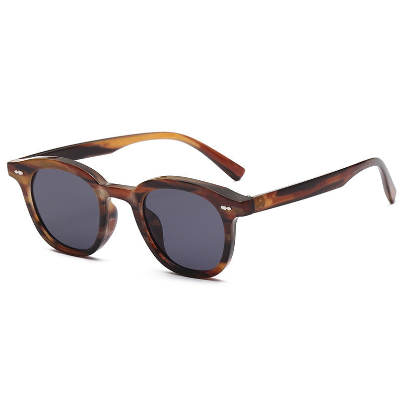 Old money tinted glasses flat lay view