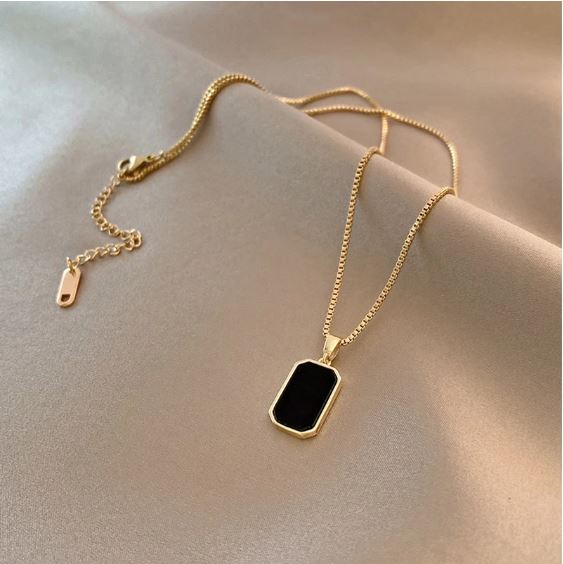 Noir gold necklace on model lifestyle