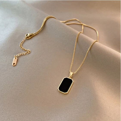 Noir gold necklace on model lifestyle