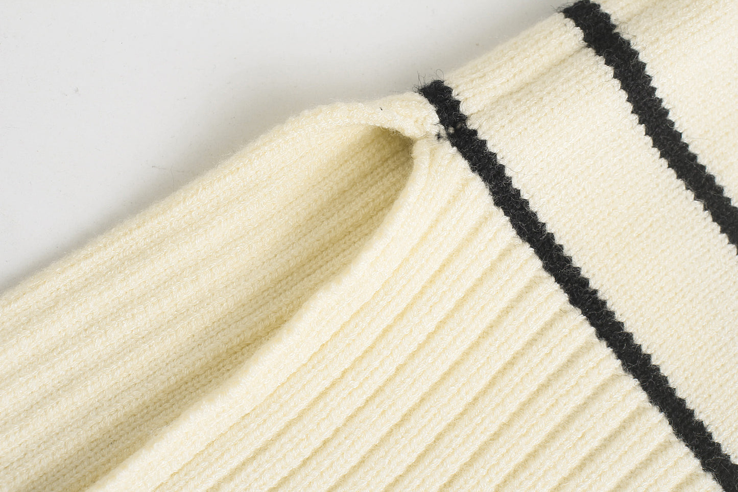 Women's chic knit sweater side view