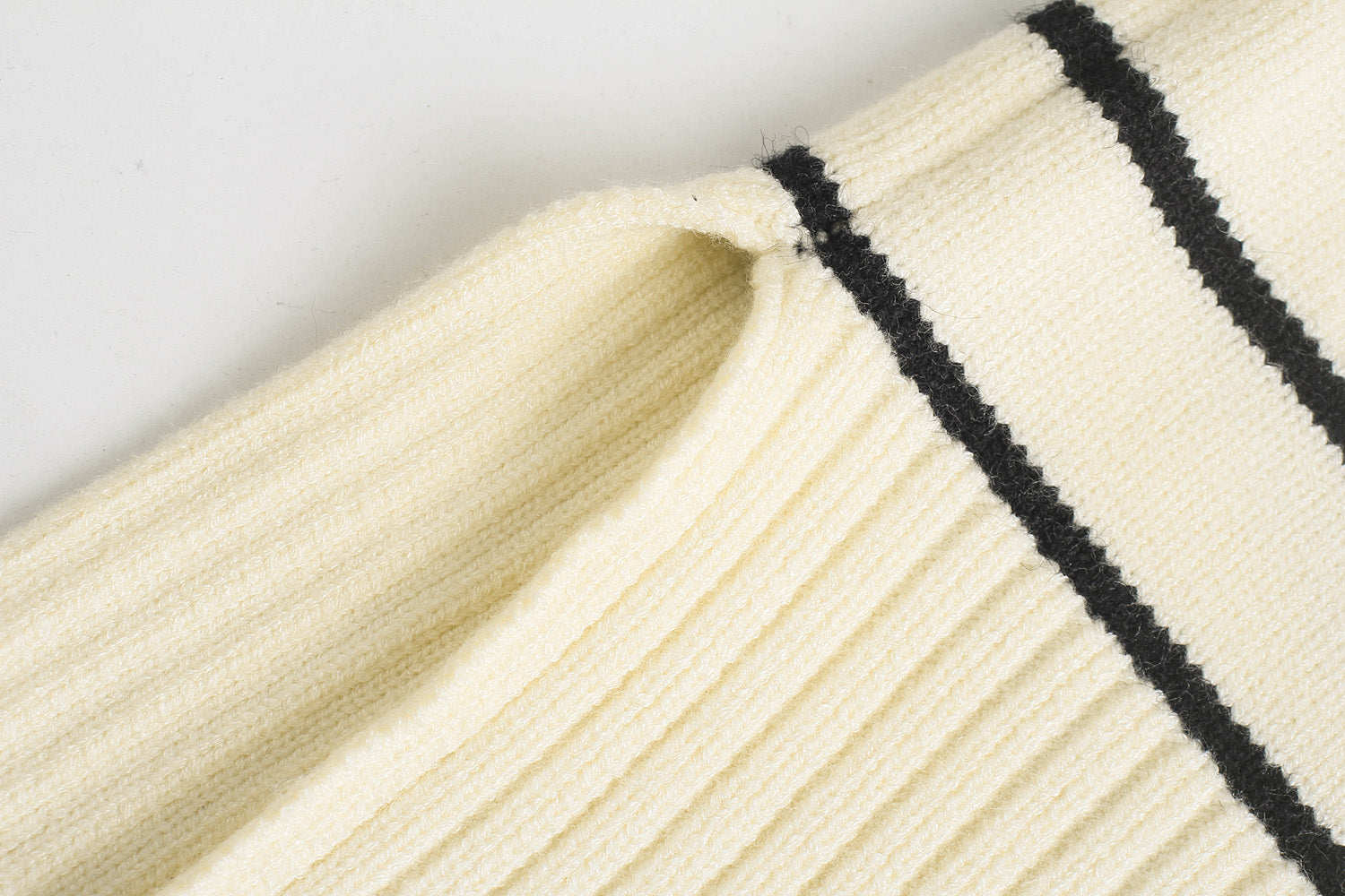 Women's chic knit sweater side view