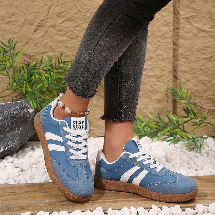 Fashionable sneakers pair view