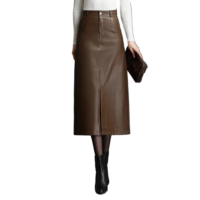 Brown leather skirt worn by a person on a gray background