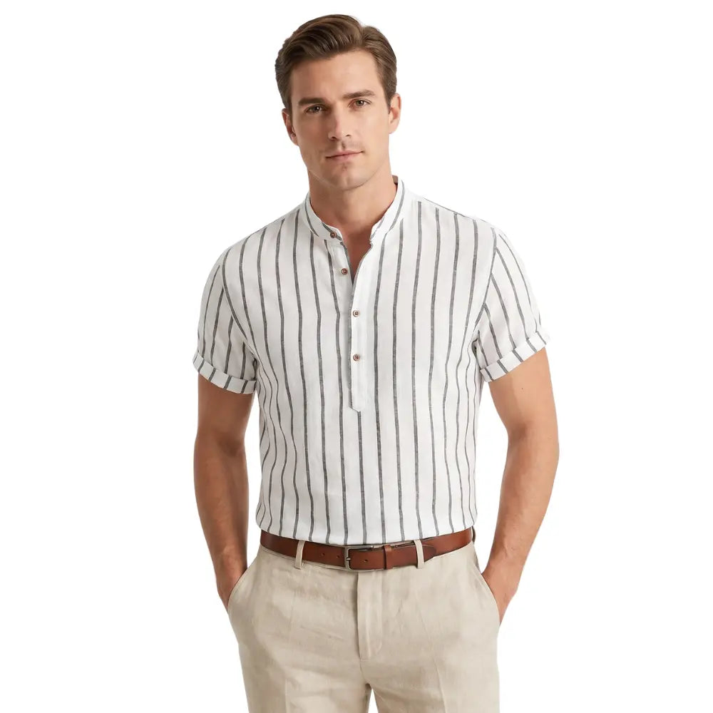 Man wearing a white and navy striped shirt with beige pants on a white background