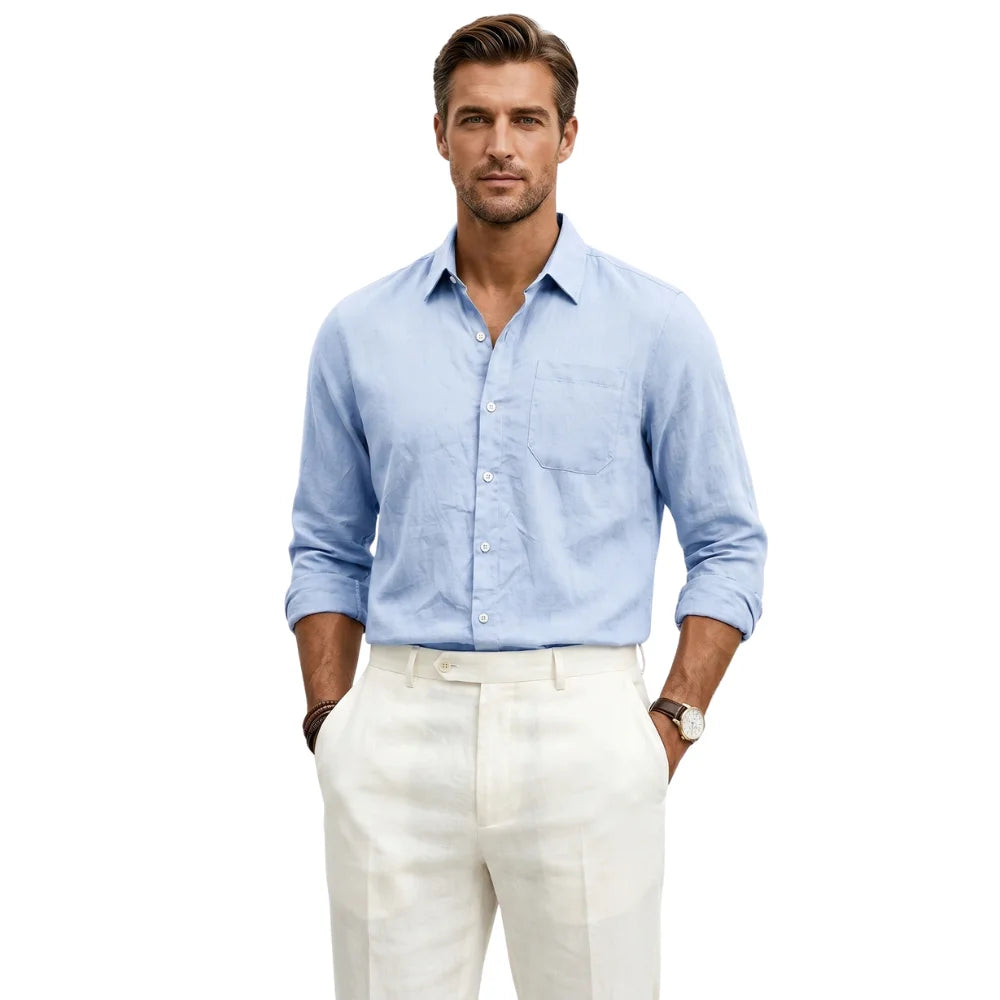 Man wearing a light blue shirt and white pants on a white background