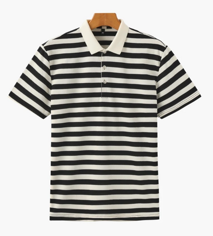 Black and white striped polo shirt on a wooden hanger against a white background