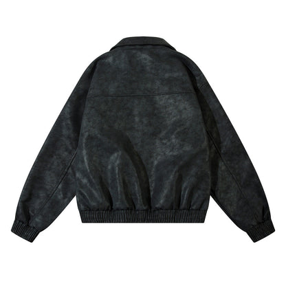 Men's vintage distressed leather jacket fabric close-up