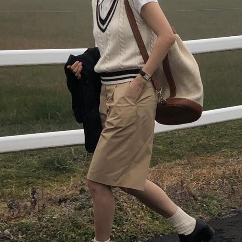 Women's rich sweater vest side view