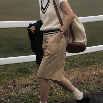 Women's rich sweater vest side view