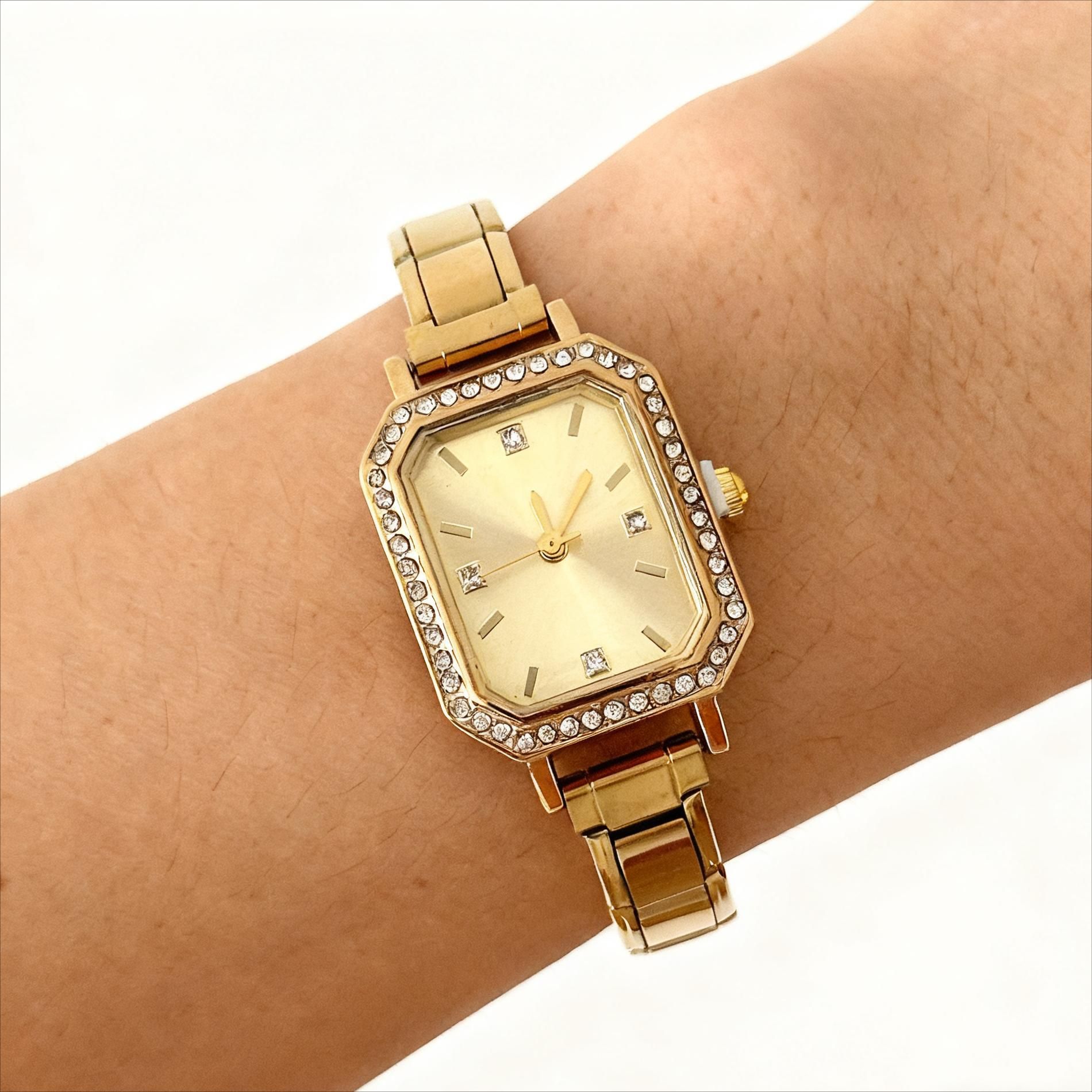 Diamond-embellished watch on wrist