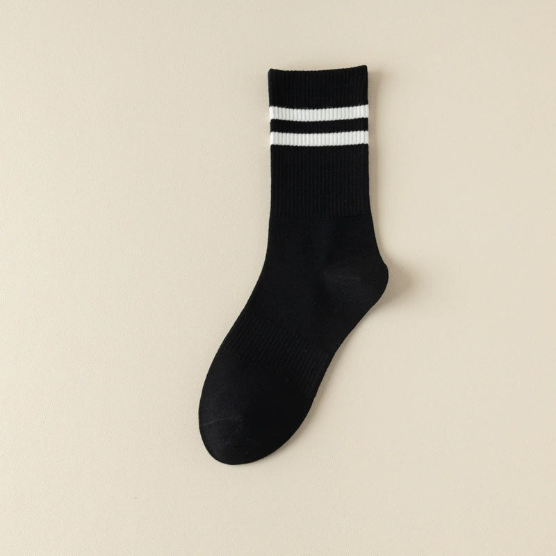 White stripe running socks on feet