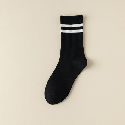 White stripe running socks on feet